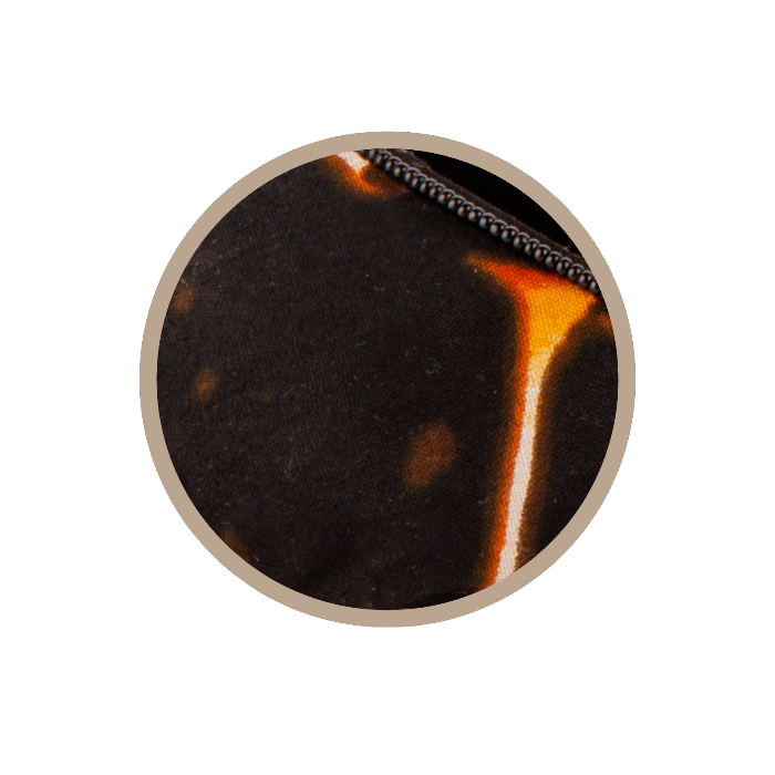 Close-up of a tortoiseshell pattern on a black background