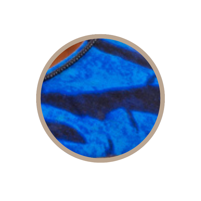 Close-up of blue fabric with a black stripe on a clear background