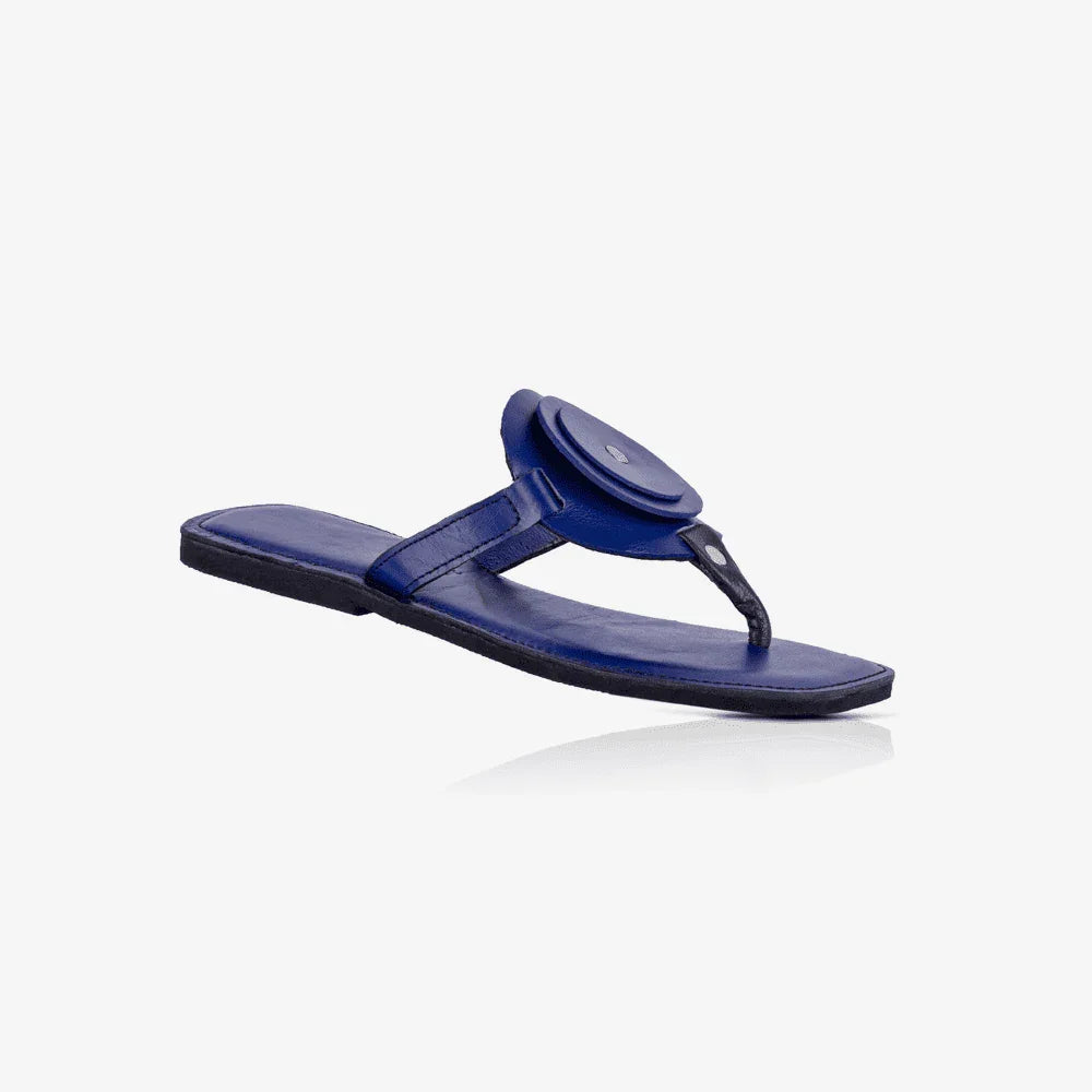 Image of blue handmade leather flat sandal with a circle design produced by Australian brand Miriam Bella