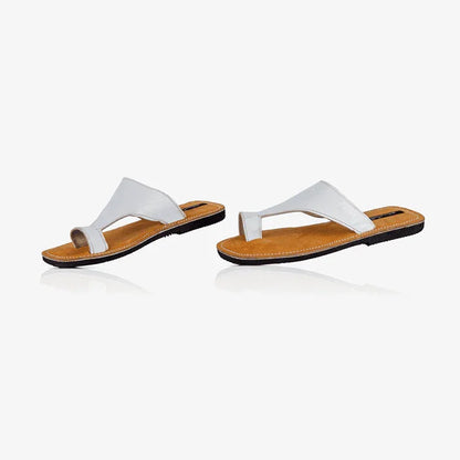 pair of white leather thong sandals, produced by Australian brand Miriam Bella