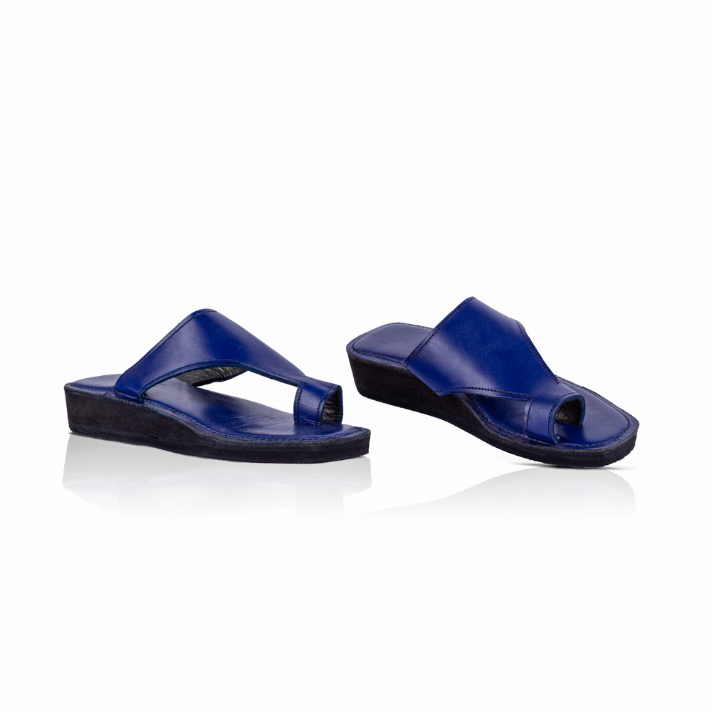A pair of blue leather thong sandals, produced by Australian brand Miriam Bella