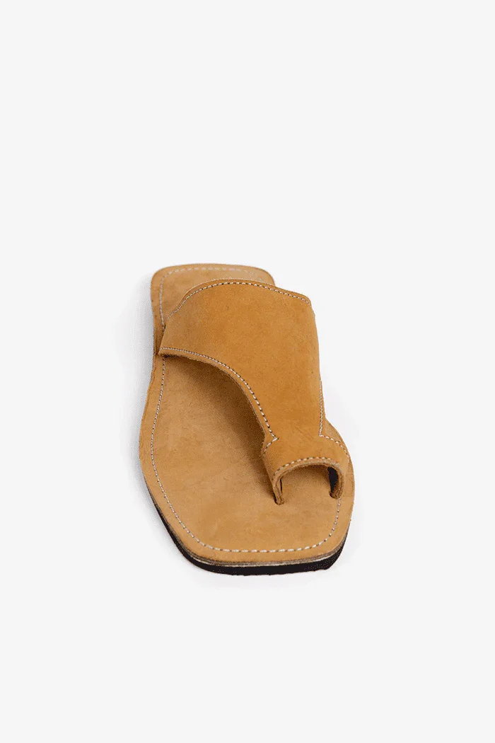 Tan sandal on a white background