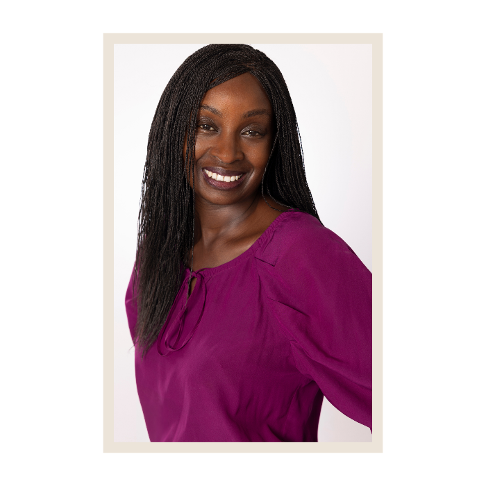 Woman wearing a purple blouse against a white background