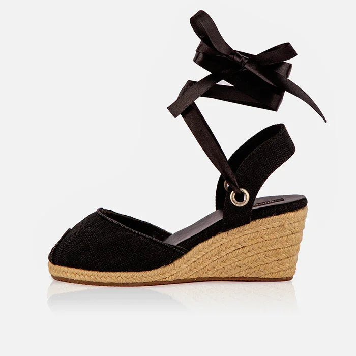 Single Gaia black canvas peep toe espadrille wedge heel with black ribbon ankle tie and jute wedge.
