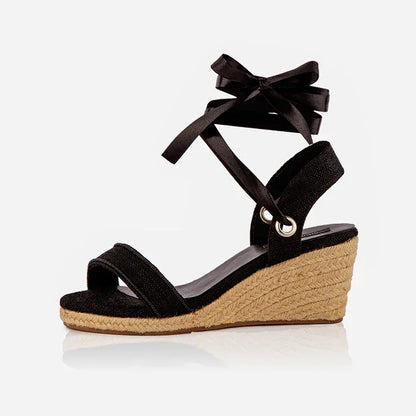 black open-toed platform espadrilles with black straps and a wedge heel, featuring a  leather lining