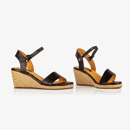Side view of Gaia black leather open toe espadrille wedge sandals with ankle straps and woven jute wedges.