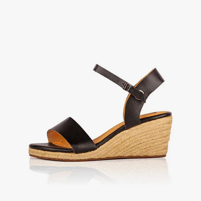 Image of a single black leather open toe espadrilles, produced by Australian brand Miriam Bella