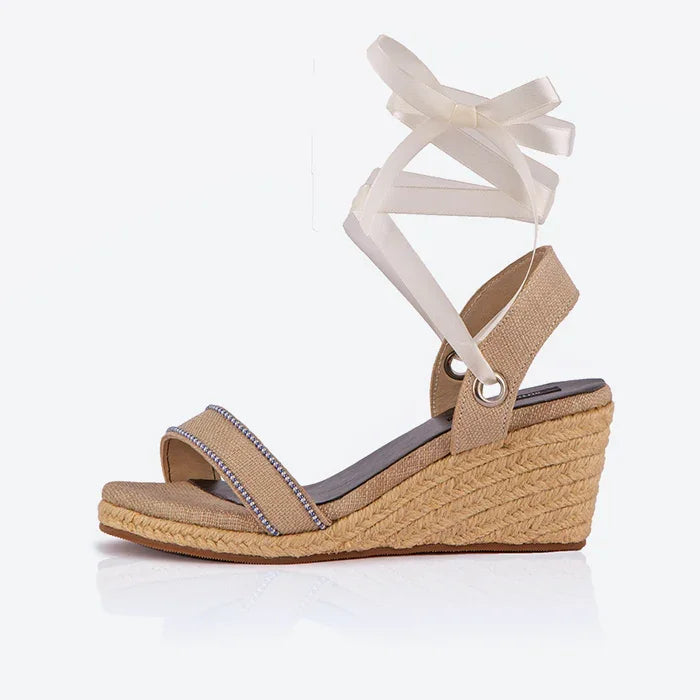 Cream open-toed platform espadrilles with black straps and a wedge heel, featuring a  leather lining