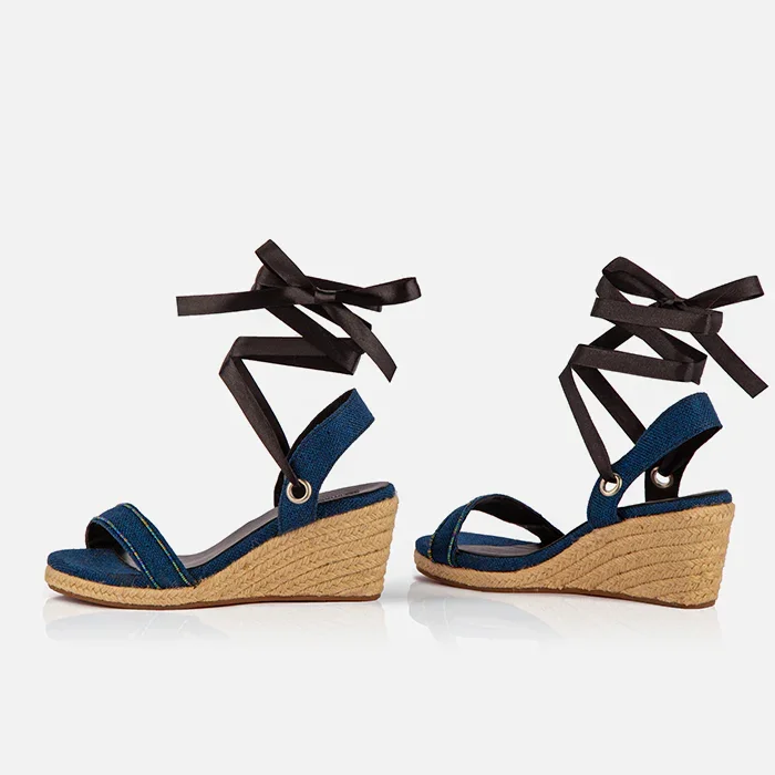 Side view of Gaia indigo canvas wedge espadrilles with black ankle ties and jute wedge heels.