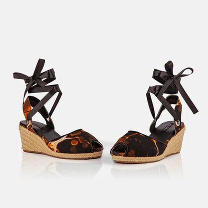 Pair of Gaia Midnight Flame espadrille wedge heels with black ankle ties and open toe design.