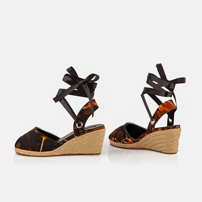 Side view of Gaia Midnight Flame espadrille wedge heels with jute wedge heel and black ribbon ankle ties