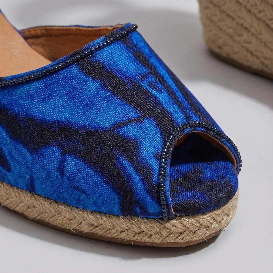 Gaia Ocean Spirit espadrille wedge sandals with blue ankle tie with jute sole on a light background