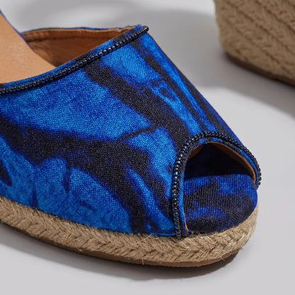 Gaia Ocean Spirit espadrille wedge sandals with blue ankle tie with jute sole on a light background