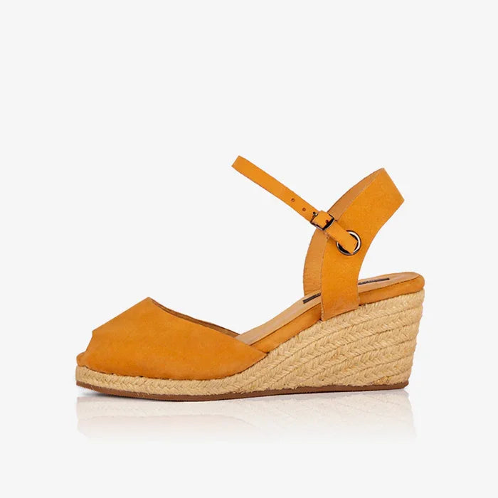 Side view of Gaia ochre leather peep toe espadrille wedge sandal with ankle strap and jute wedge. 