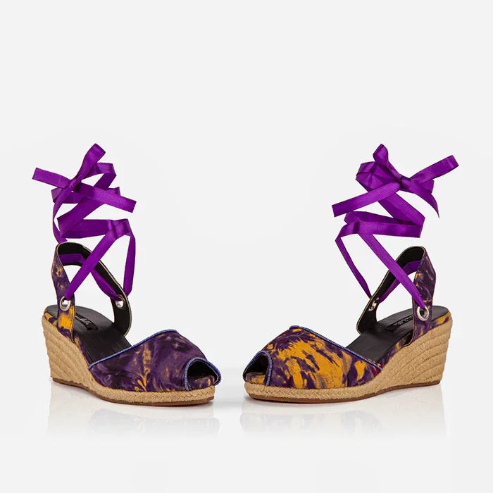 Pair of Gaia Royal Ember espadrille wedge heels with purple ankle ties and peep toe design.