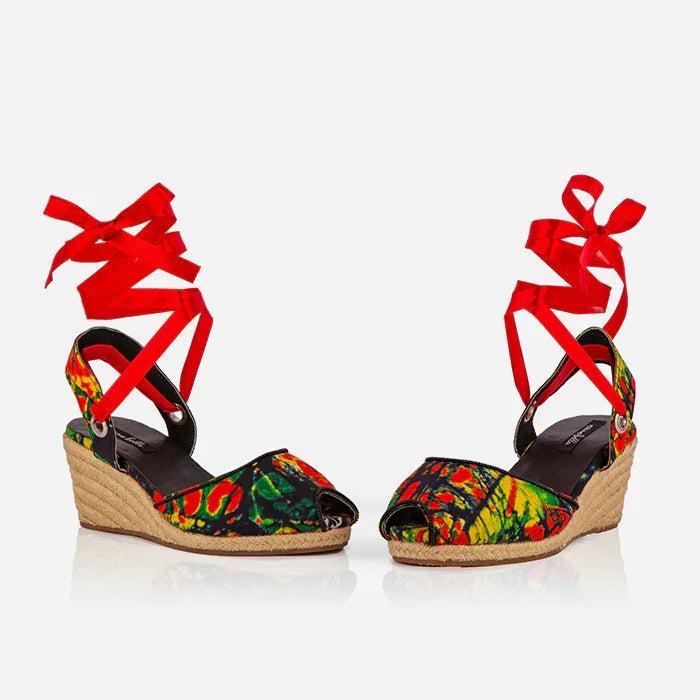 Side view of Gaia Wild Flame espadrille wedge sandals with red ribbon ankle ties and jute wedge heel.