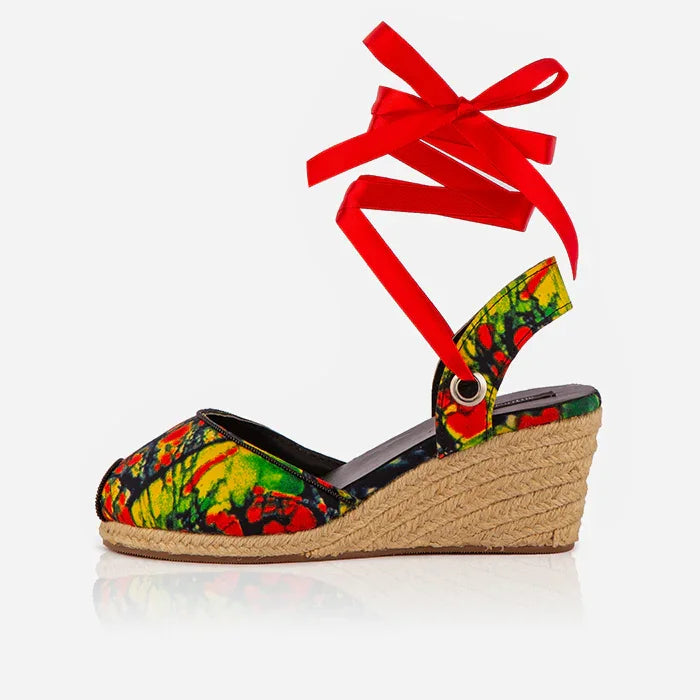 Single Gaia Wild Flame espadrille wedge sandals with red ankle tie, printed canvas upper and jute wedge.