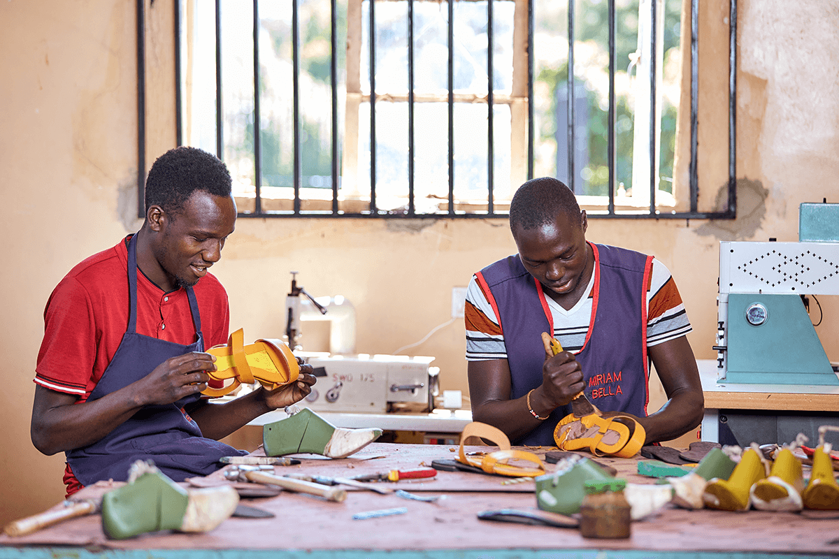 Kenya artisans making Miriam Bella leather sandals by hand in the workshop.