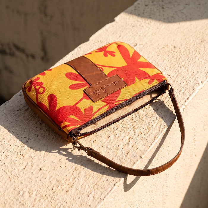 Floral Mini Tote Bag laying flat on a stone bench