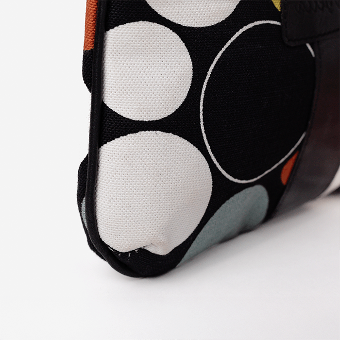 Close-up of the Black Print Mini Tote Bag for Women, a fabric pouch with circular patterns on a white background