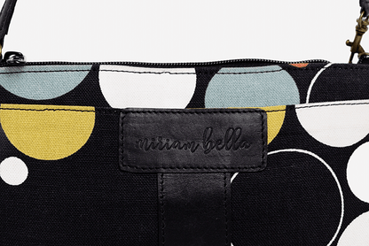 The Black Print Mini Tote Bag for Women, a Black pouch with geometric patterns and 'Miriam Bella' branding on a light gray background