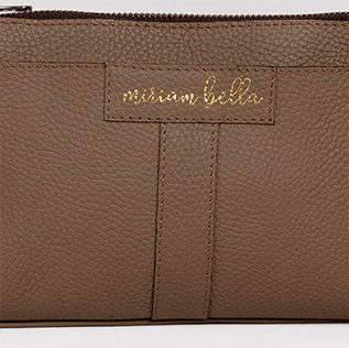 The Mini Tote, a brown leather pouch with 'Miriam Bella' branding on a white background