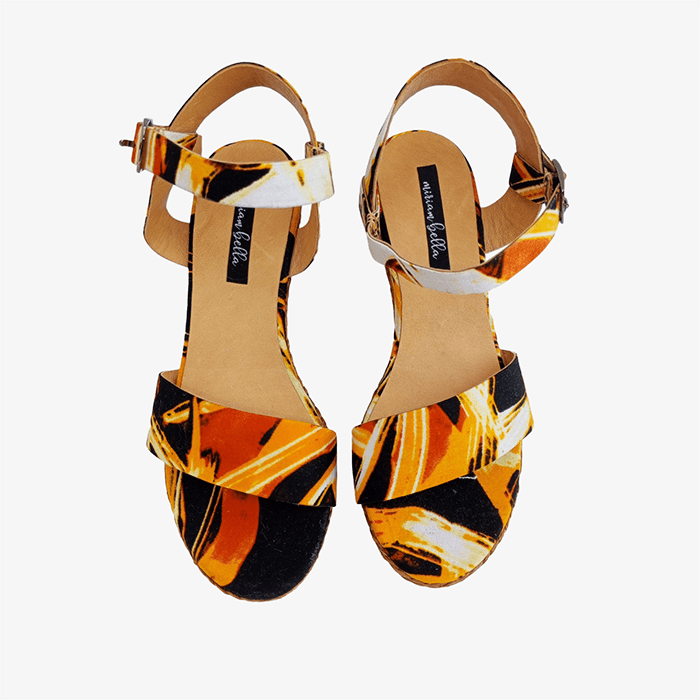 Pair of sandals with a colorful pattern on a white background
