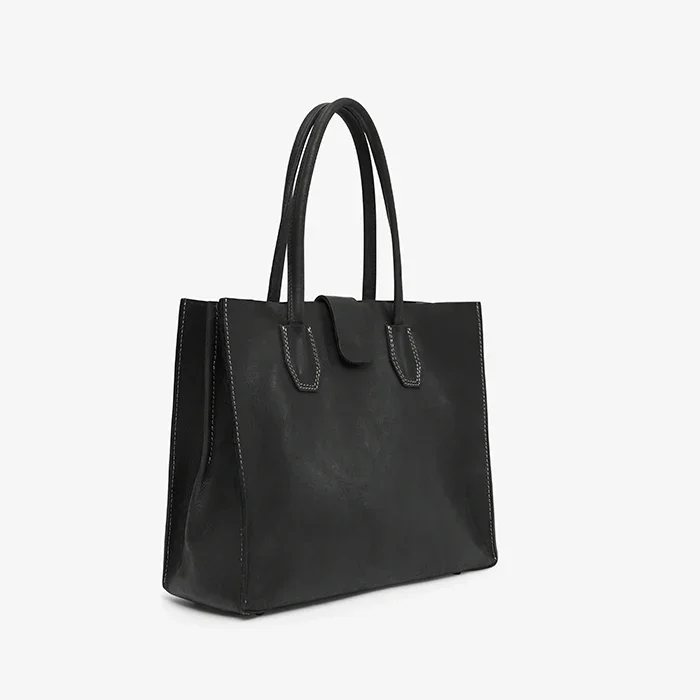 Black leather tote bag on a white background