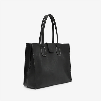Black leather tote bag on a white background