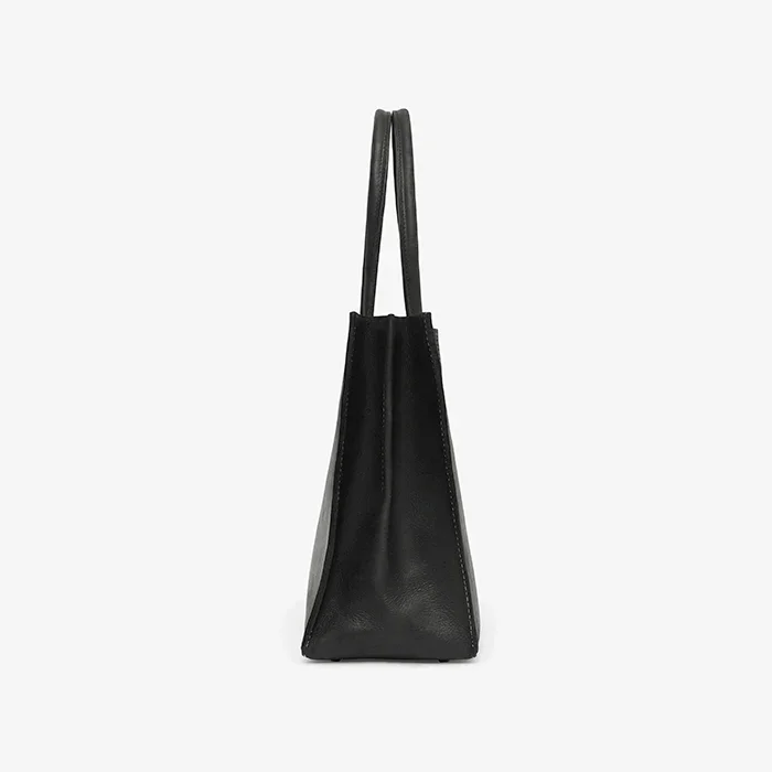 Black leather tote bag on a white background