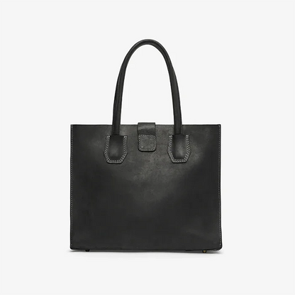 Black leather tote handbag on a light gray background