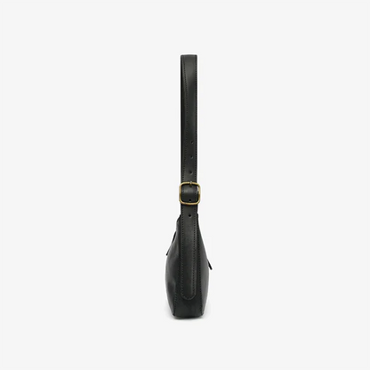Black leather mini shoulder bag with a strap on a white background